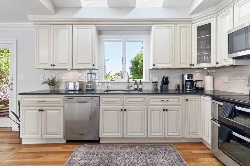 Kitchen oversees the backyard and upper deck