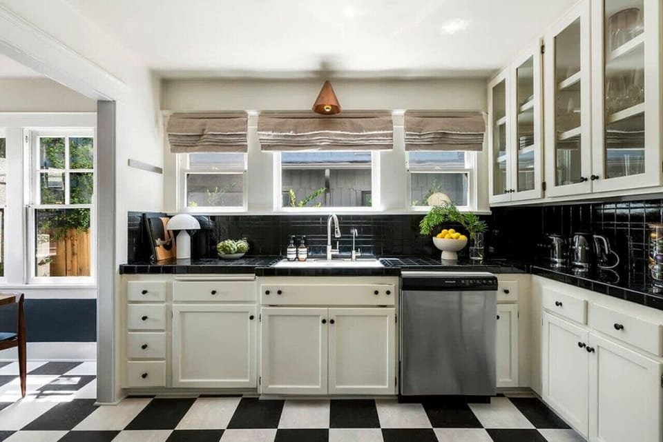 Modern black and white kitchen with a sleek and stylish design