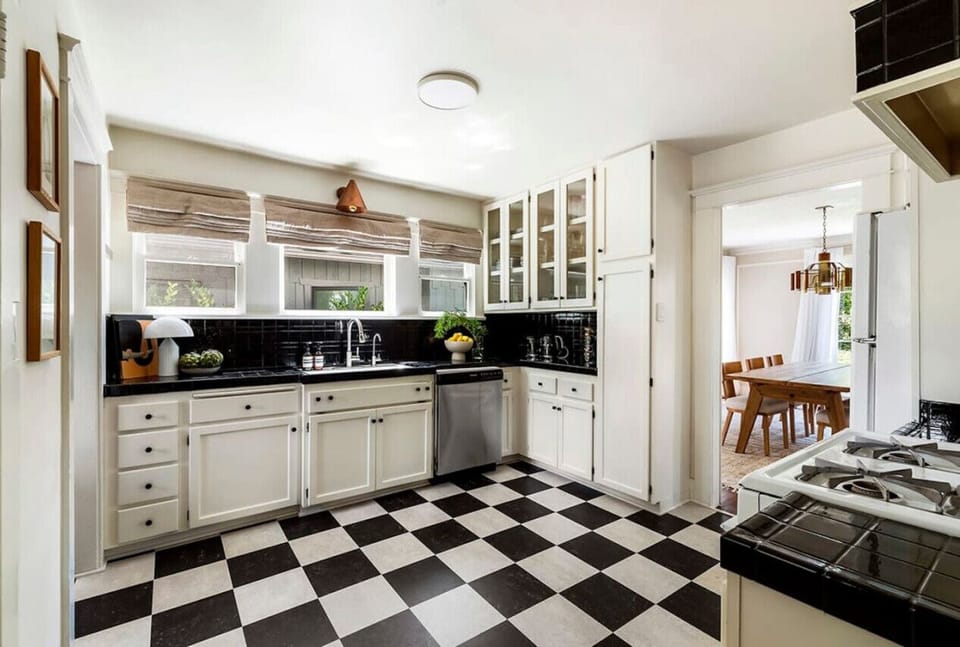 Modern black and white kitchen with a sleek and stylish design