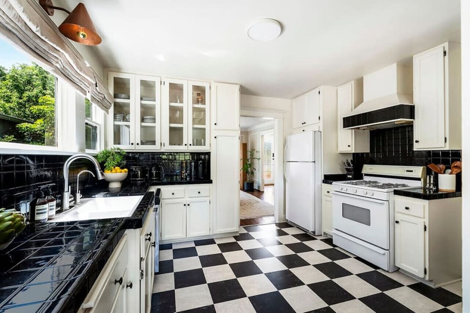 Modern black and white kitchen with a sleek and stylish design