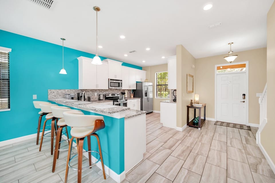 Sleek kitchen island with bar seating, perfect for casual breakfasts or dinners. 