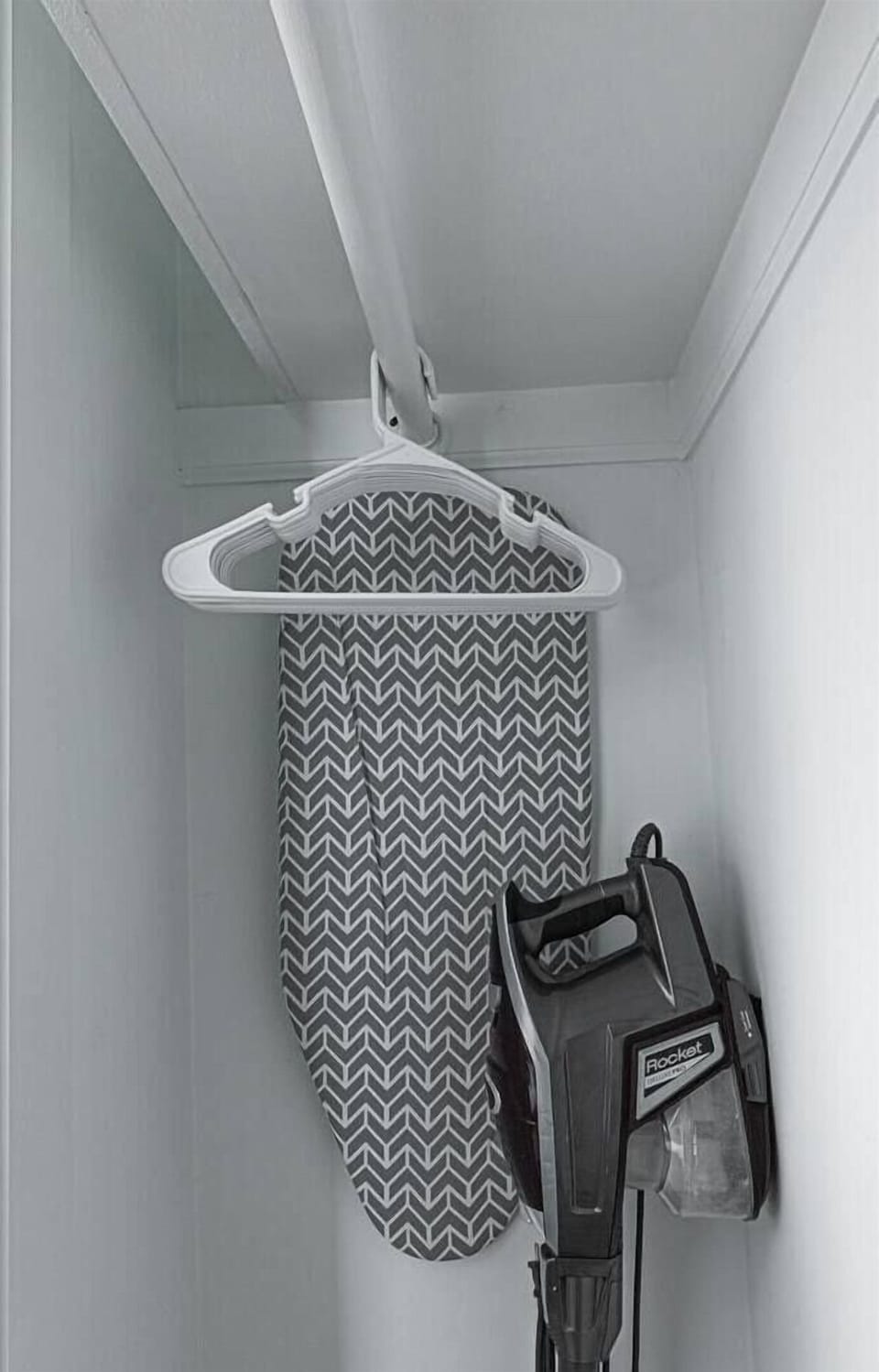 Hangers, countertop sized ironing board, & vacuum stored in the master bedroom closet. Iron, Pac 'n' Play, and high chair also stored on shelf in the closet (not pictured)