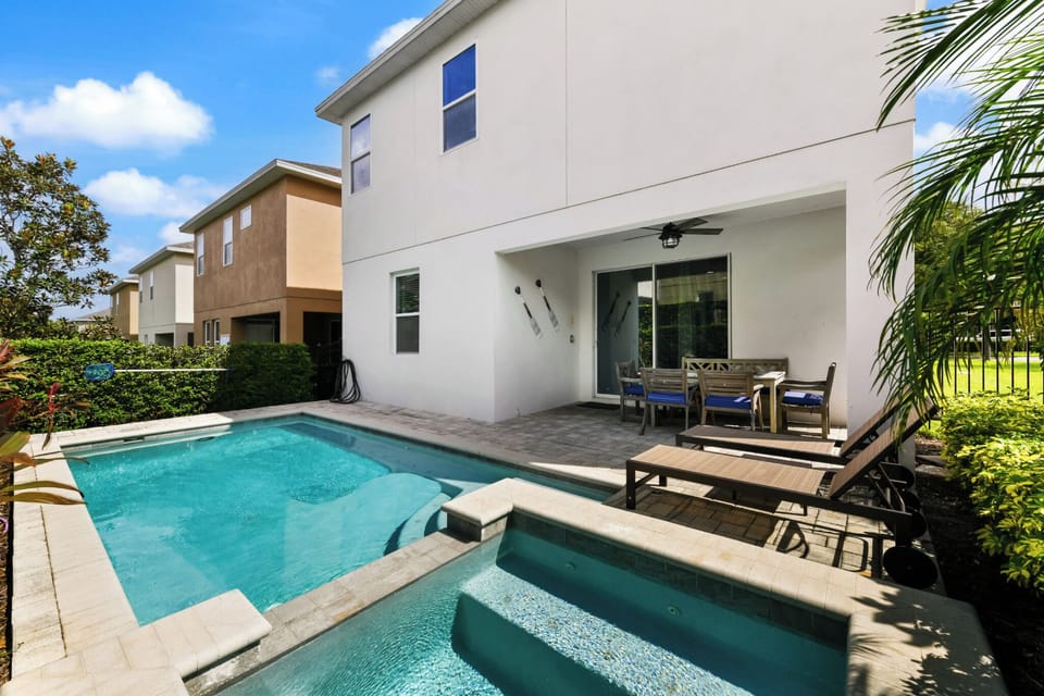 POOL & SPA:  Cozy outdoor seating with a fan to keep cool in style.