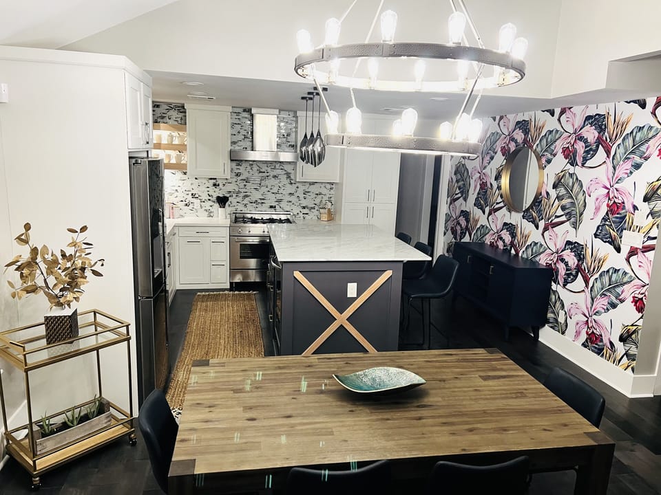 Seating for 10. Dining table with 4 chairs and a bench to seat 7. Bar 3 seats.