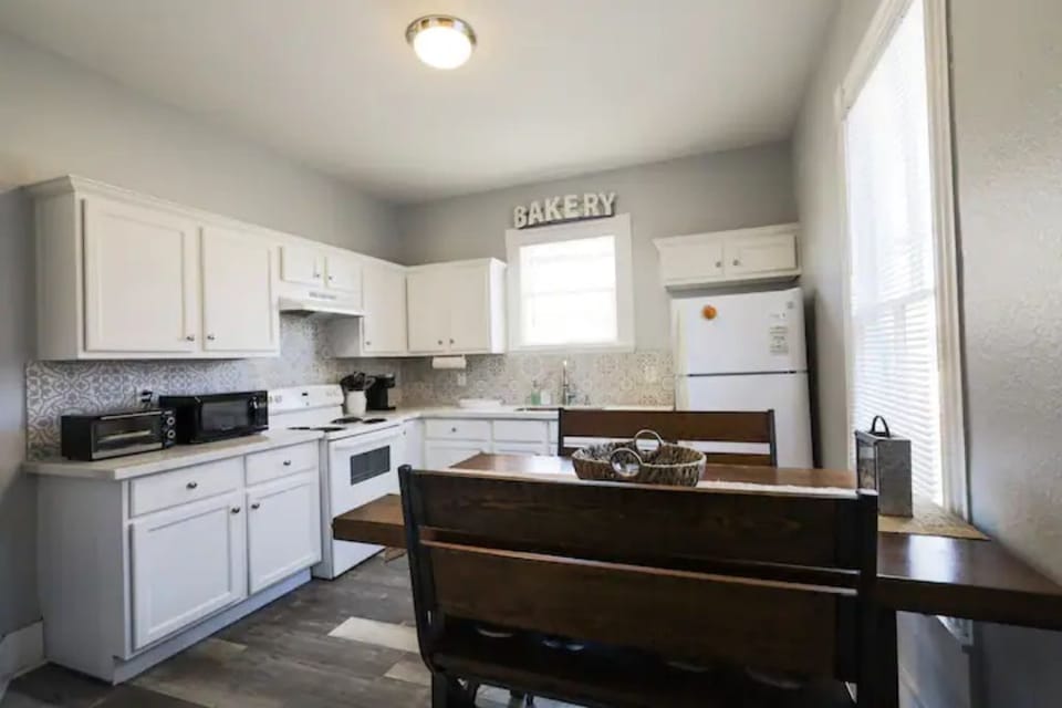 The newly renovated kitchen is spacious and fully stocked.