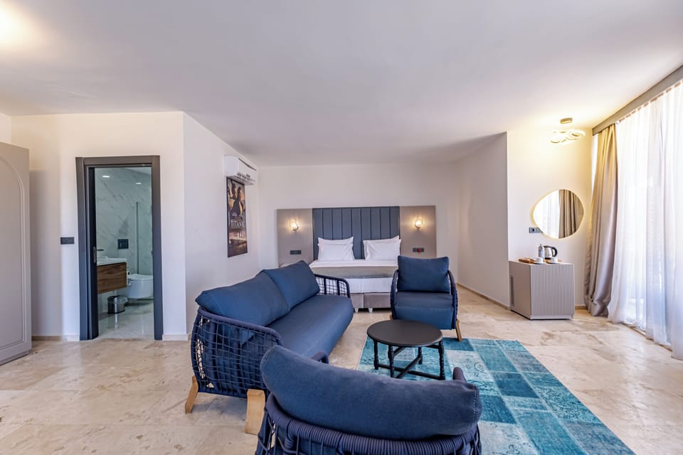 Suite Room | Living area | 120-inch Smart TV with satellite channels, TV, heated floors