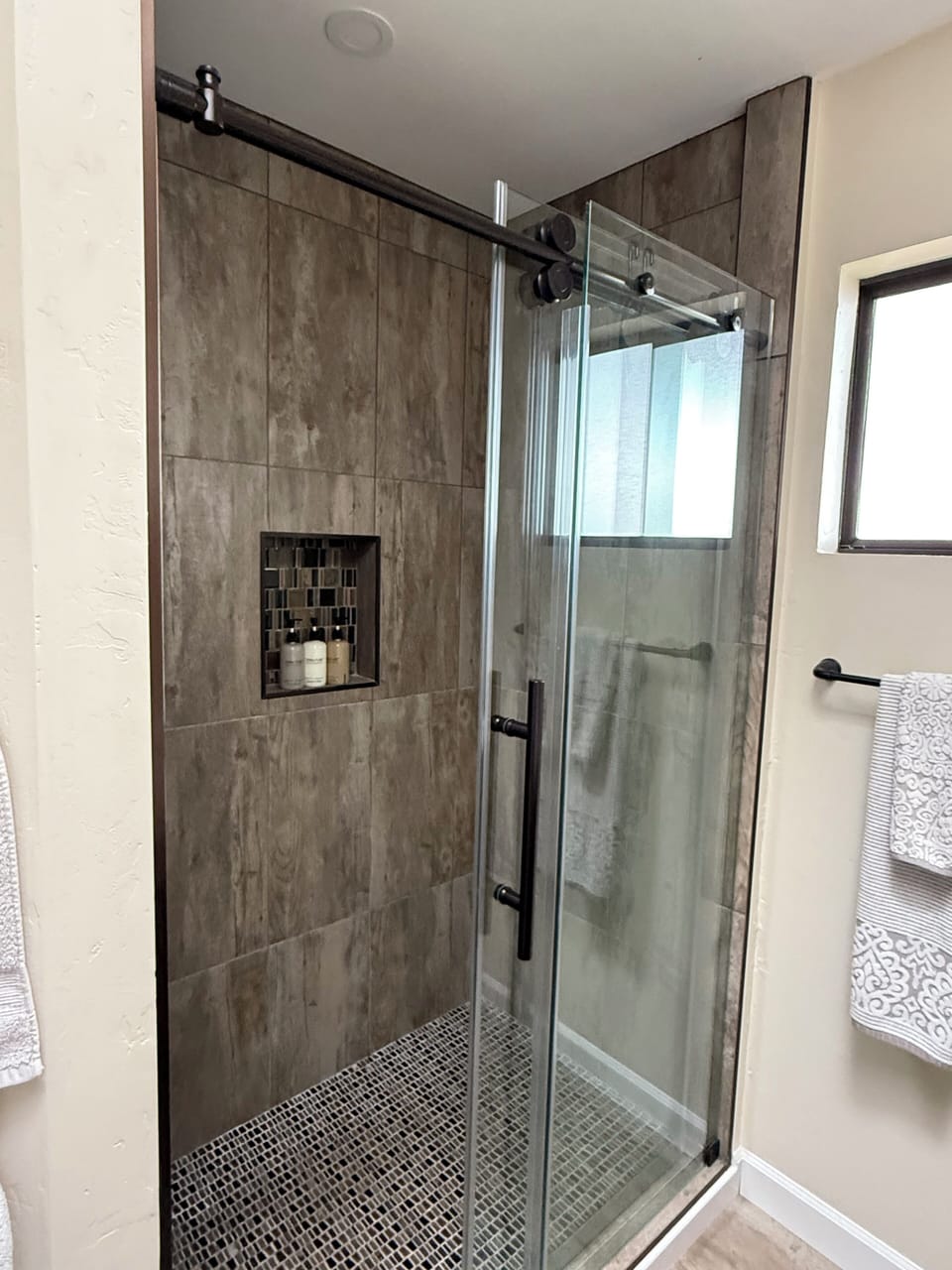 Tile shower in master bathroom