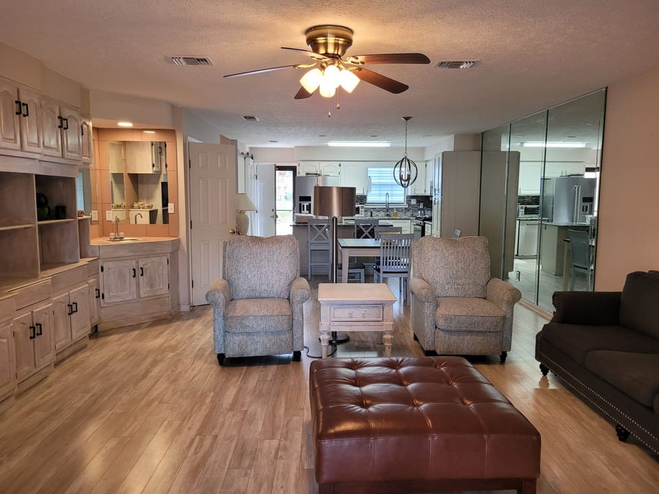 Spacious living area; lots of storage for long stays. 2  recliners & sofa. TV
