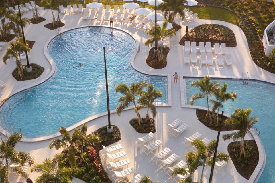 Our multi-tiered lagoon-style Super pool offers generous space for swimming, relaxing, and gathering in a vibrant, upscale setting.