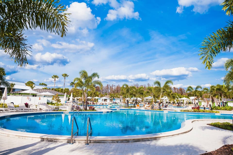 Experience Saddlebrook’s expansive resort-style pool surrounded by lush palms, spacious sun decks, and private cabanas.