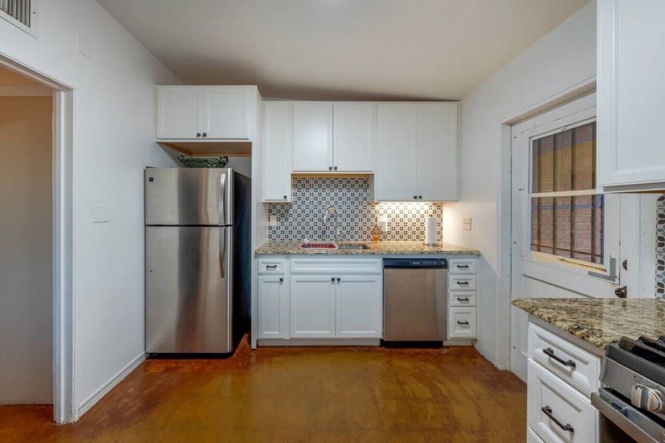 Updated kitchen with stainless steel refrigerator