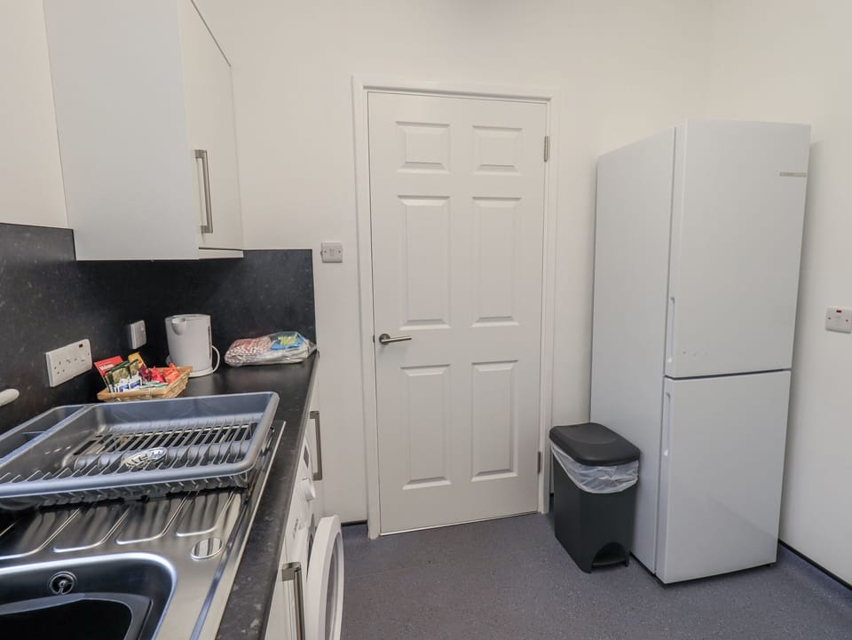 Fridge, electric kettle, toaster, cookware/dishes/utensils