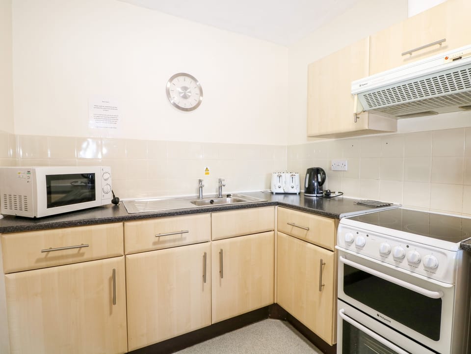 Fridge, electric kettle, toaster, cookware/dishes/utensils