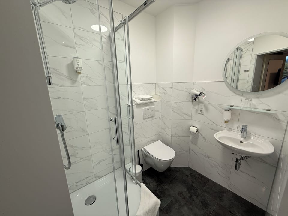 Standard Double Room | Bathroom | Shower, hair dryer, towels, soap