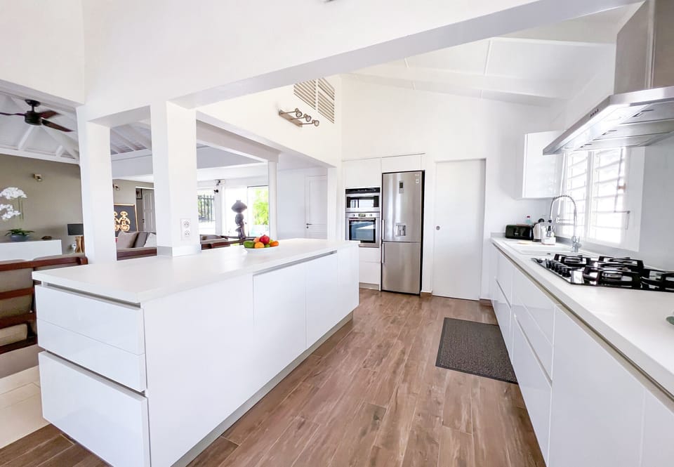 Large American kitchen equipped with Nespresso coffee machine and hood