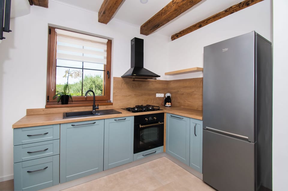 Villa | Private kitchen | Fridge, microwave, oven, stovetop