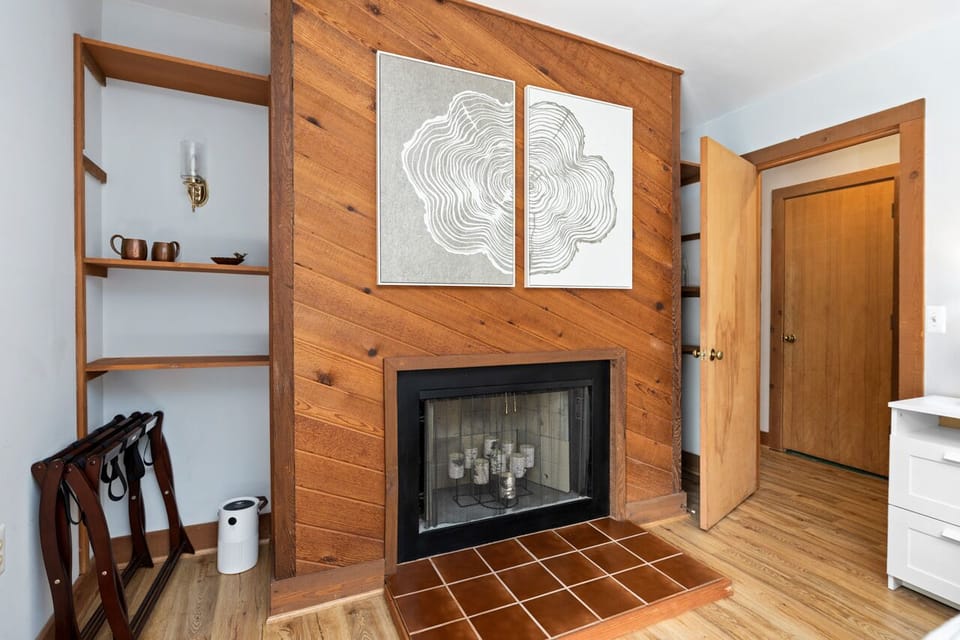 master bedroom on main w/ decorative fireplace