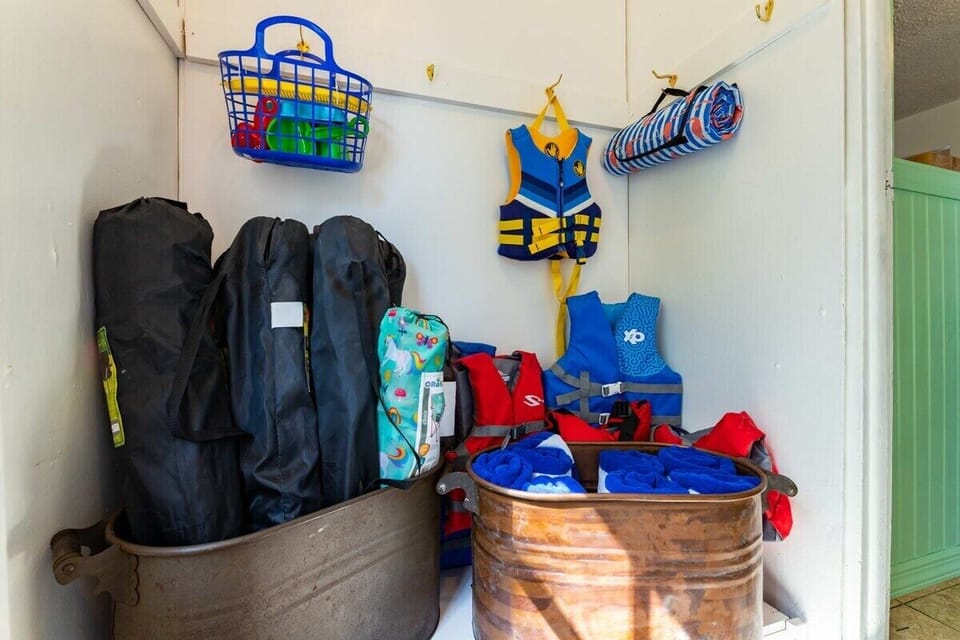 [Entryway, Downstairs] Equip yourself with all the essentials for lake adventures and don't overlook the bikes outside!