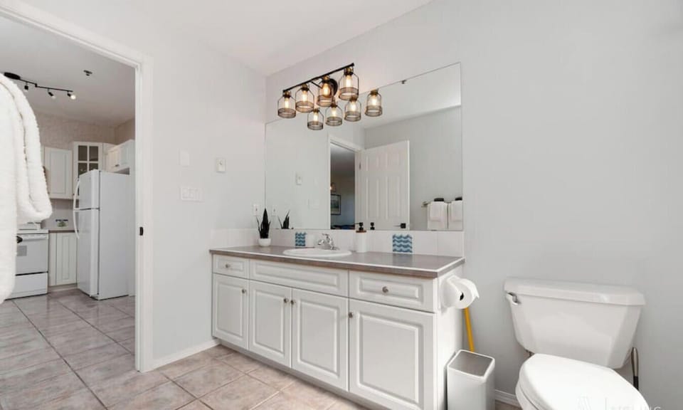 Full bathroom with a shower/tub combo. Each bathroom comes stocked with towels, a hair dryer, shampoo, conditioner & body wash.