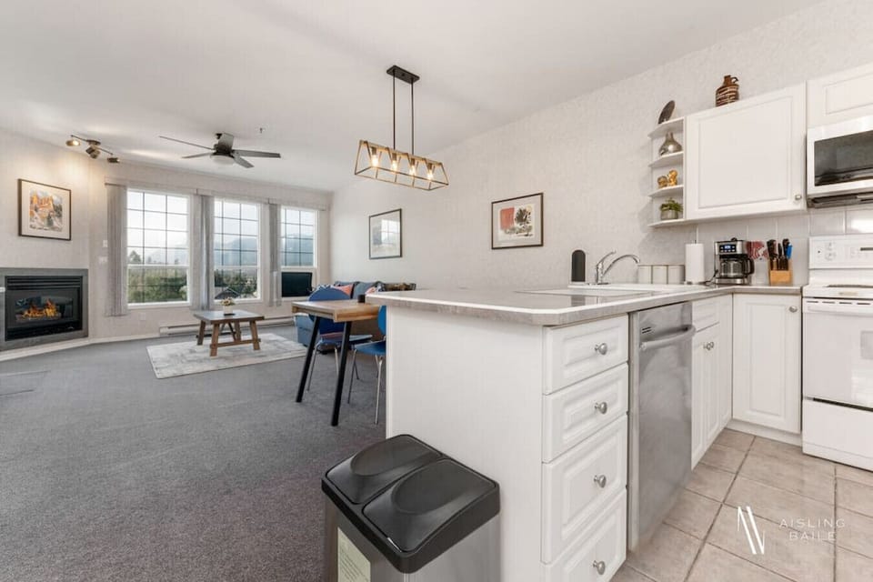 Full kitchen with a drip coffee machine, ground coffee, tea, sugar, and basic condiments (ketchup, mustard, relish.)