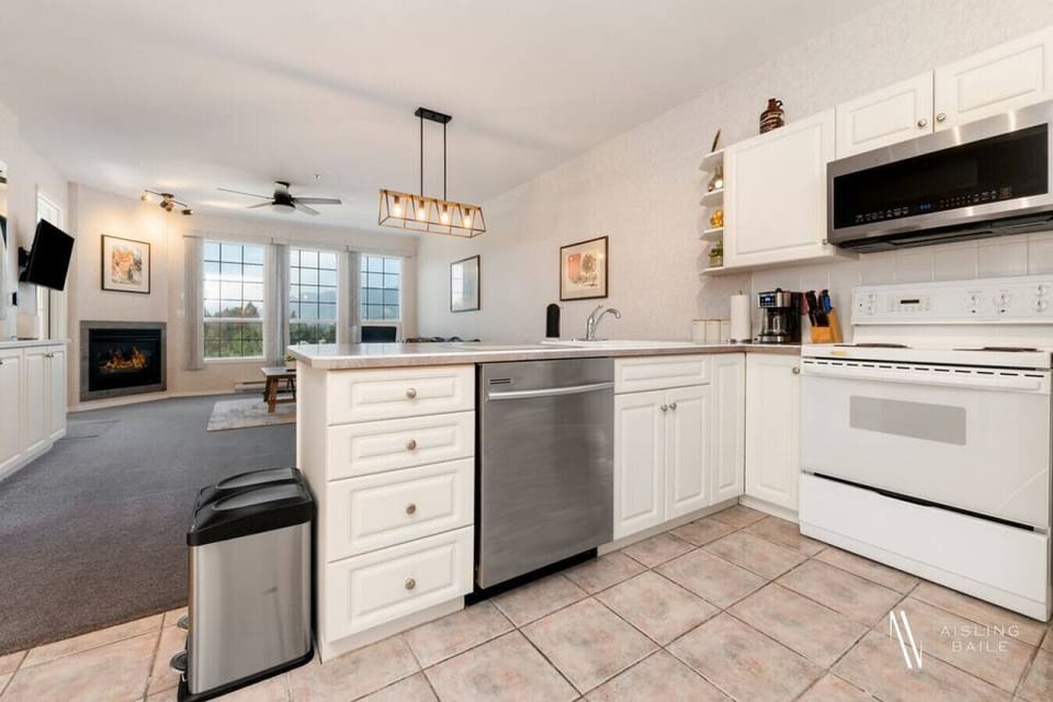 Full kitchen with a drip coffee machine, ground coffee, tea, sugar, and basic condiments (ketchup, mustard, relish.)