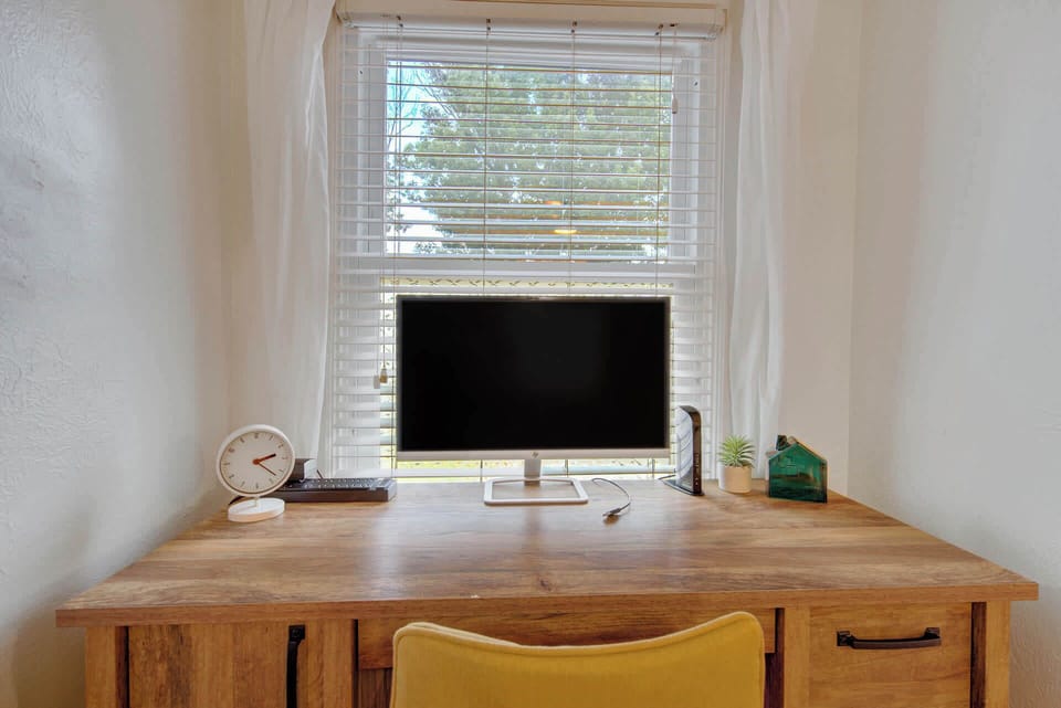 This work space with a large monitor for ease of working at "home" during your stay!