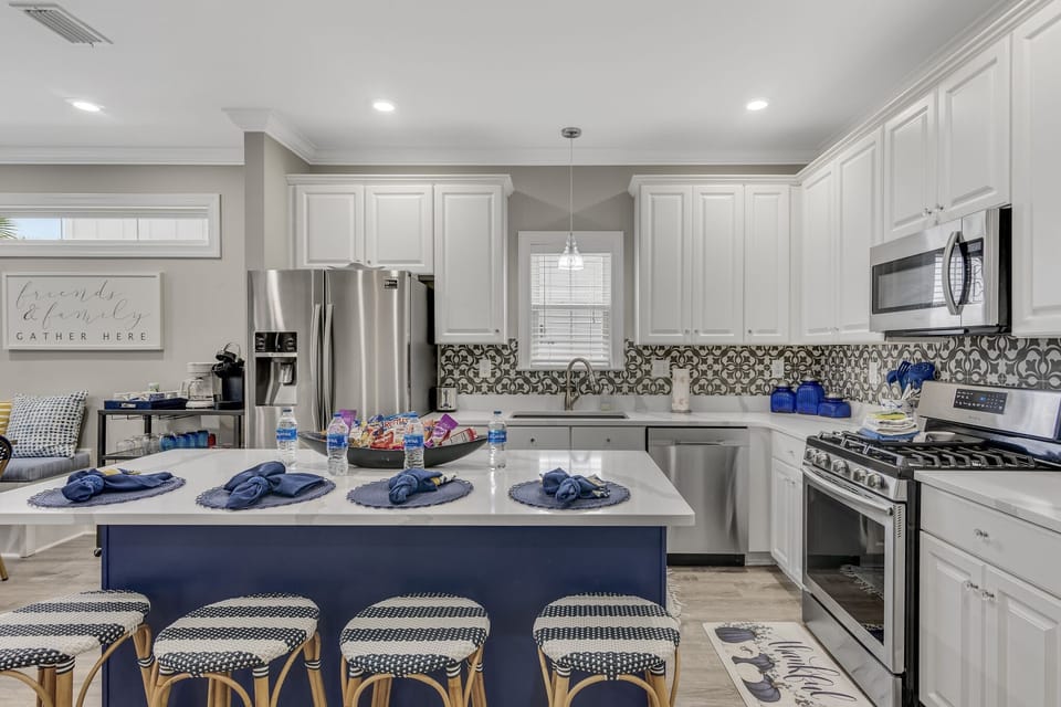Remodeled kitchen has quartz countertops, stainless appliances - fully stocked with more than the basics (coffee/tea bar, oils/spices, Tupperware, plenty of pots/pans/cookware).