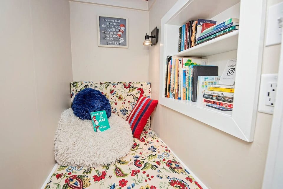 The Cherry St House Book Nook is a beloved space for both children and adults. It offers a cozy reading cubby where you can catch up on your reading..