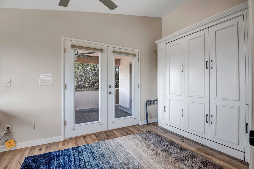 Bedroom Four with a Queen Murphy Bed and Access to Patio Deck