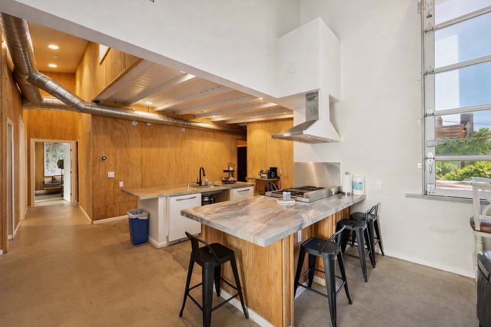 Kitchen: Surf Loft–Style Chef Kitchen with Large Island, Bar Seating, and an Open-Concept Design — Perfect for UP TO 25 GUEST EXPERIENCE and Social Gatherings