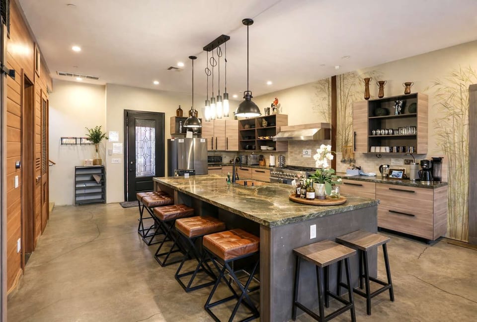 Modern Rustic Kitchen & Dining Area – Spacious Island Seating, Warm Wood Accents, and Open-Concept Design Perfect for Cooking, Entertaining & Group Gatherings