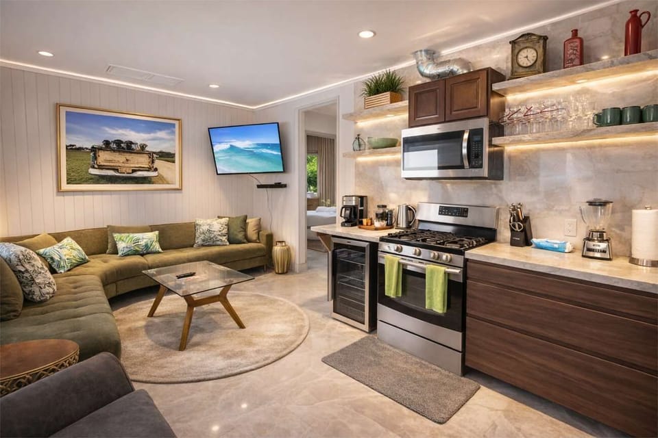 Open-Concept Kitchen & Living Area with Modern Appliances and Relaxed Seating
