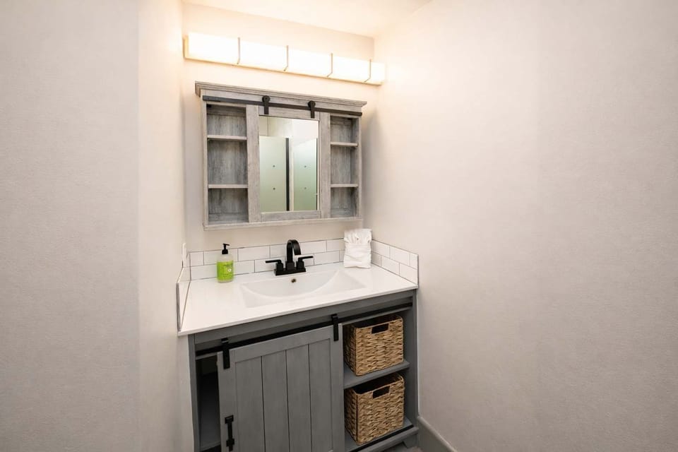 Clean Bathroom Vanity with Modern Sink and Storage

