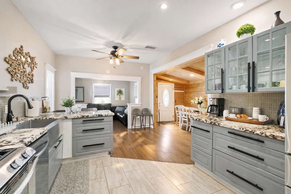 Spacious Modern Kitchen with Large Island, Elegant Finishes & Open Flow into Dining Area Perfect for Entertaining