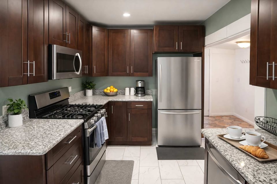 Sleek Modern Kitchen w/ Granite Counters, Stainless Steel Appliances & Rich Wood Cabinets | Bright, Functional Layout Perfect for Cooking, Coffee & Entertaining 🍽️✨
