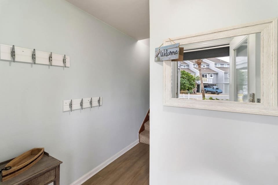 Drop your keys, hang your bags, check yourself in the foyer mirror — vacation mode officially on.