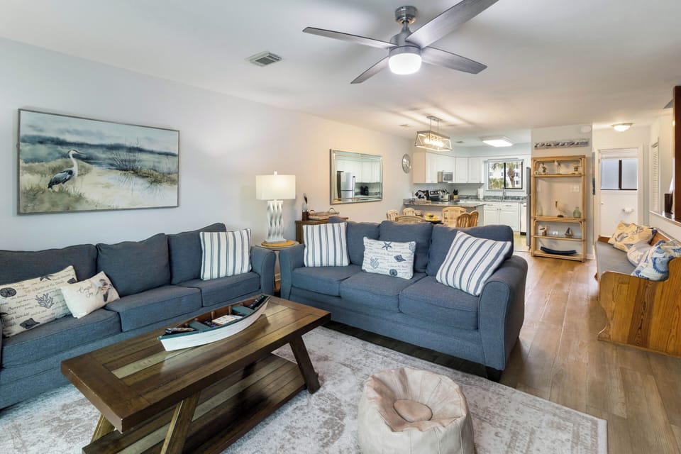 Pull out the queen sleeper sofa and the living room becomes a bedroom — eight guests, no one on the floor.