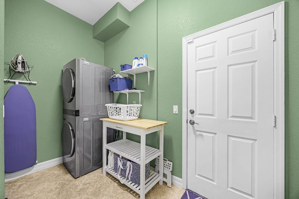 The laundry room is located inside the residence