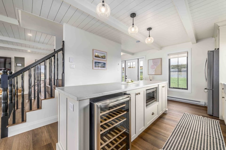 The stylish kitchen is a welcoming area with a wine fridge to store your wine at the perfect temperature