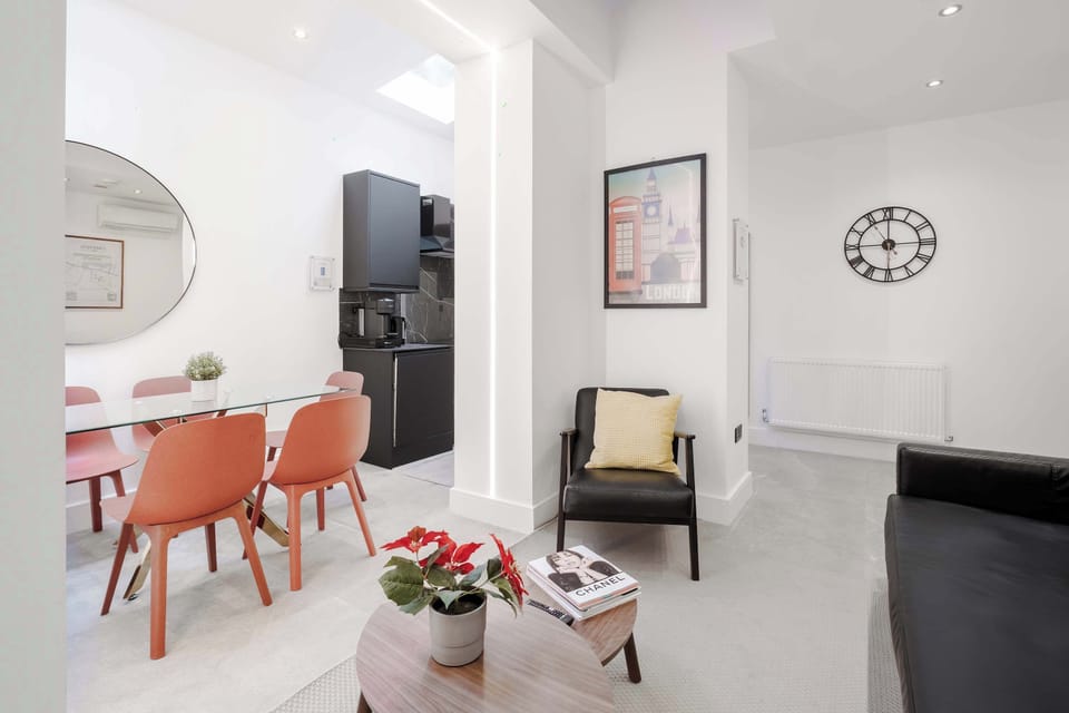 Living Room | Experience comfort in our beautifully designed living room, featuring a state-of-the-art 65-inch smart TV and premium air conditioning to ensure a cool and relaxing stay.