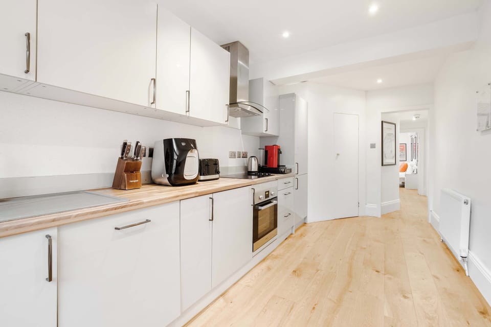 Full Kitchen | Fully equipped with everything you could possibly need, including a fresh filtered water dispenser, dishwasher, washing machine and dryer, a Nespresso machine with pods, plus all the cooking utensils and essentials for preparing meals 