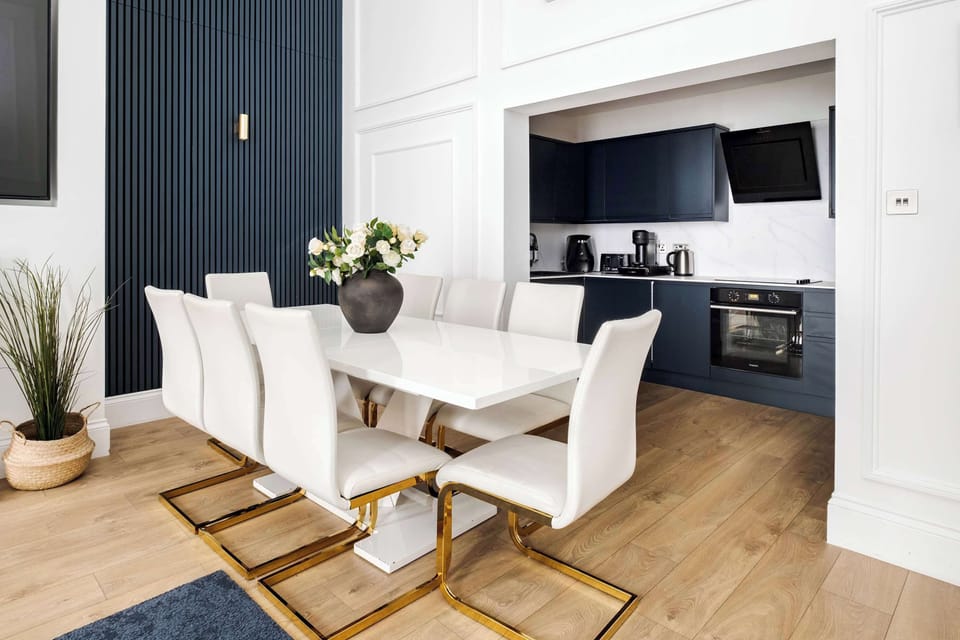 Living Room | Thoughtfully designed living room with a royal touch, the super high ceilings create an atmosphere of comfort, elegance, and distinction. Experience an impressive 90 inch TV providing a true private cinema experience.