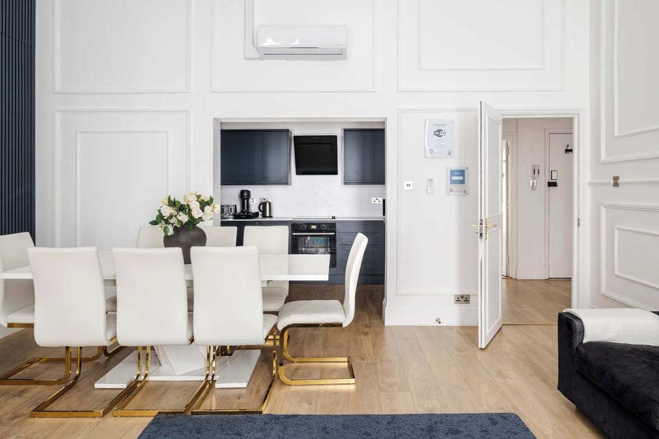 Living Room | Thoughtfully designed living room with a royal touch, the super high ceilings create an atmosphere of comfort, elegance, and distinction. Experience an impressive 90 inch TV providing a true private cinema experience.