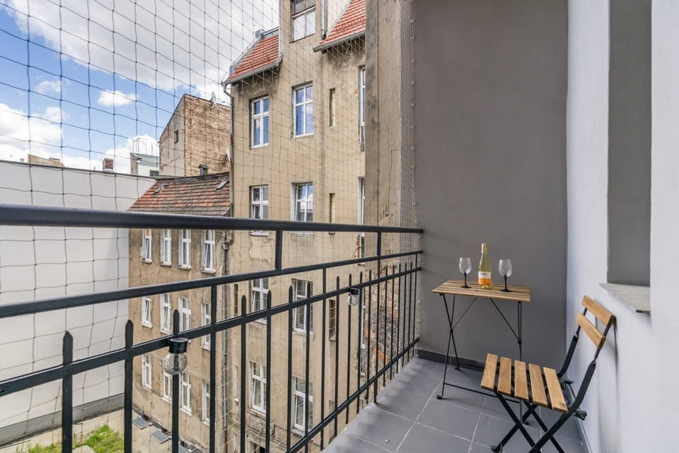 A view from the balcony overlooking the charming architecture of the surrounding neighborhood.
