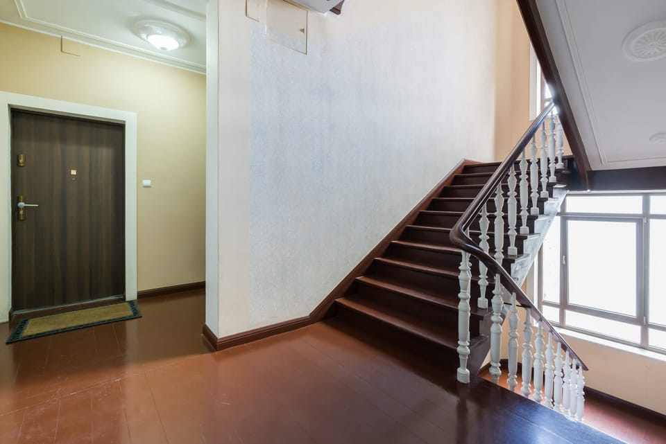 A staircase in the building, featuring a clean and well-maintained layout with natural light.
