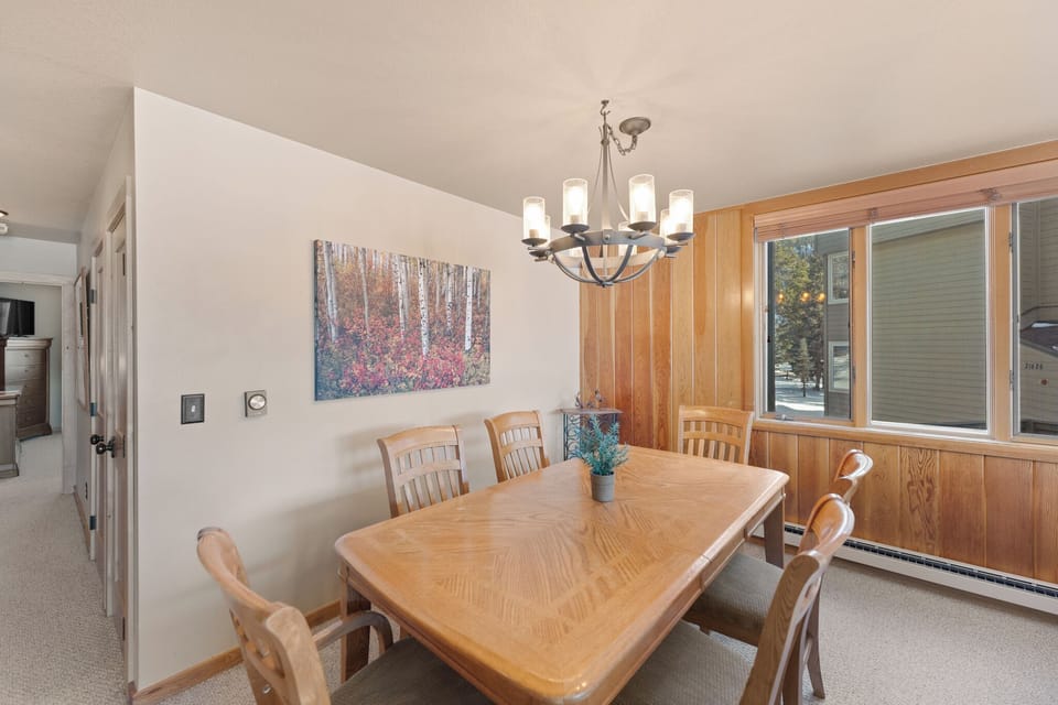 Gather around this warm wooden dining table where memories are made over delicious meals and meaningful conversations.