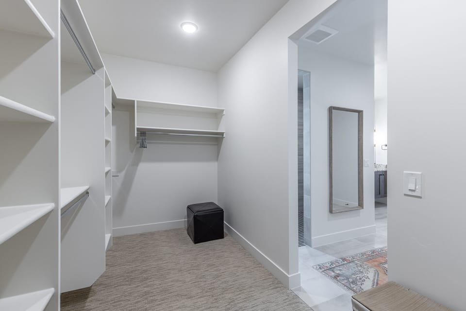 Main bedroom closet - The main bedroom includes a spacious walk in closet with enough room for all your belongings.