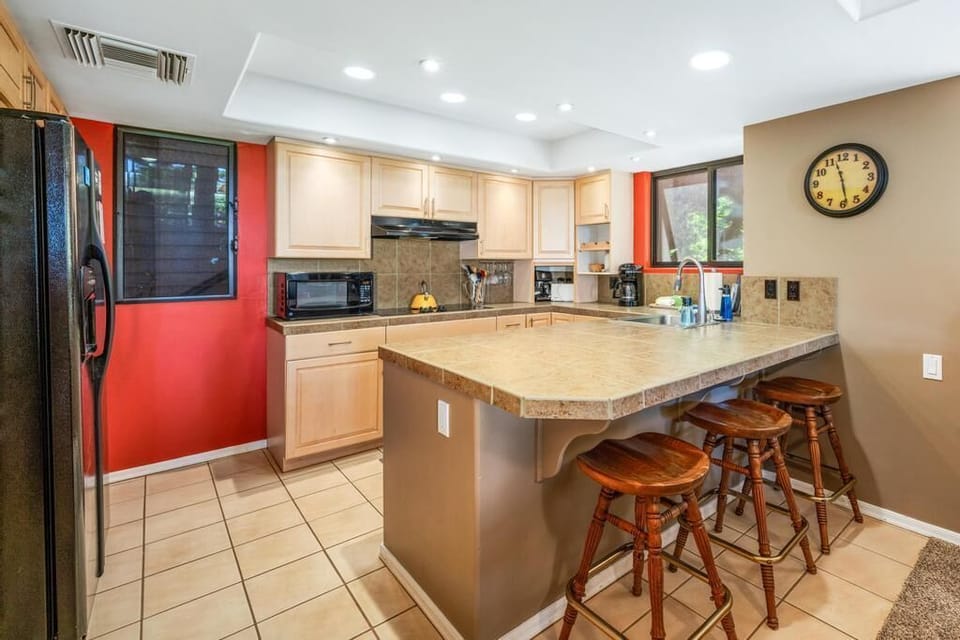 Kitchen area with bar seating 