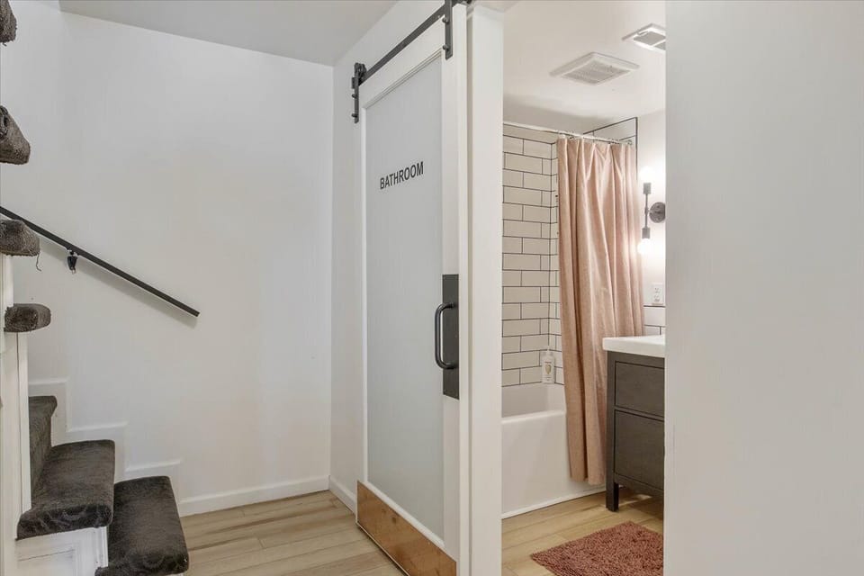 The downstairs bathroom, sliding door closed.