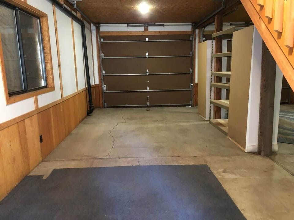 Open garage area below the cabin.